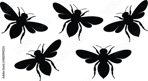 Assortment of five solid black bee or wasp silhouettes showing varied flight postures on white