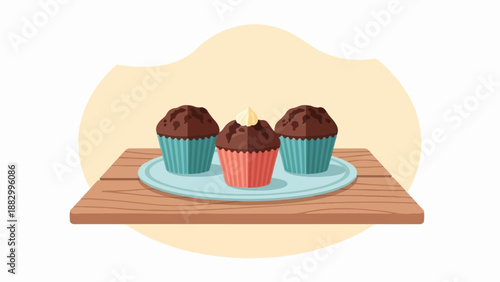 Three chocolate muffins on a plate on a wooden table