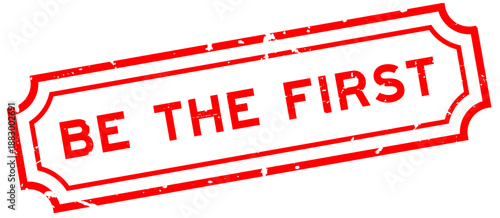 Grunge red be the first word rubber seal stamp on white background