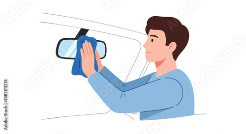Attentive individual performing routine car interior maintenance by wiping rearview mirror