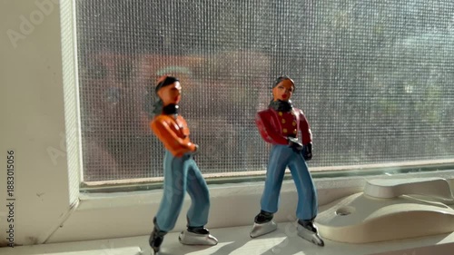 Figurines displayed on a window frame