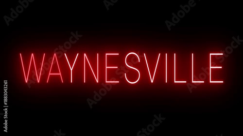 Glowing and blinking red retro neon sign for WAYNESVILLE, a tourist attraction in North Carolia