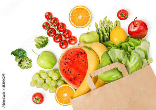 paper bag with vegetables and fruits lying on an isolated white background