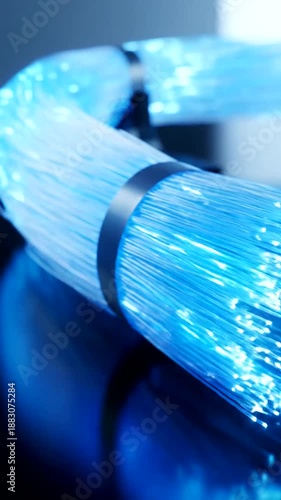 Fiber Optic Cables Illuminating with Blue Light for High-Speed Data Transmission.