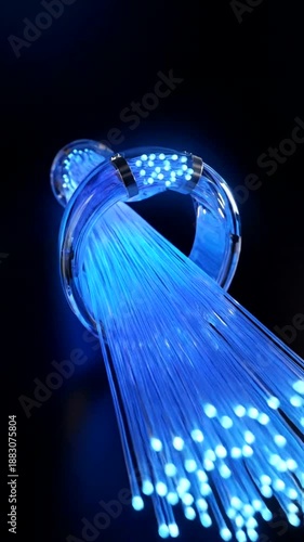 Fiber Optic Cables Illuminating with Blue Light on a Dark Background, Representing High-Speed Data Transfer and Modern Communication Technology.