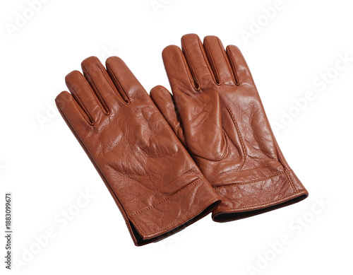 A pair of brown leather gloves lies on a dark background