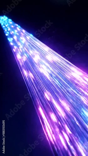 Dynamic Fiber Optic Cables Illuminating with Blue and Purple Light on Dark Background.