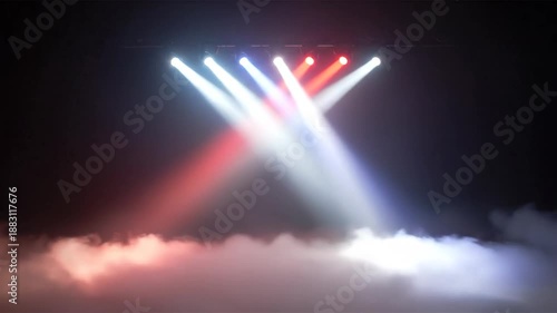 Stage lighting with white, blue, and red spotlights shining through smoke, creating a vibrant atmosphere.