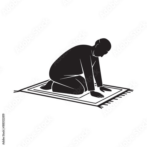 Silhouette of a Muslim Man Performing Sujud Prayer on a Traditional Mat.