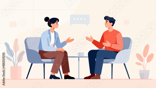 Two people are sitting in chairs and talking to each other. The man is wearing a red shirt and the woman is wearing a blue shirt