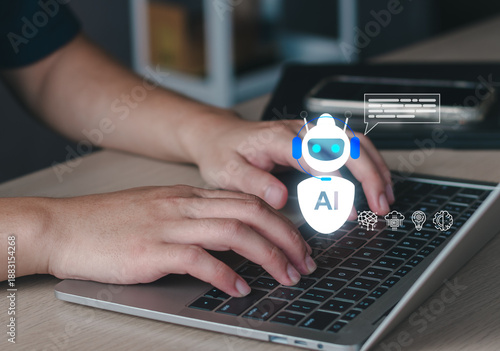 Businessman using laptop with futuristic AI interface. Concept of artificial intelligence, AI assistant, machine learning, generative AI tools, automation, and tech innovation.