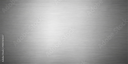 Polished silver brushed metal plate featuring a shiny industrial stainless steel texture and grey metallic aluminum surface pattern for a sleek backdrop