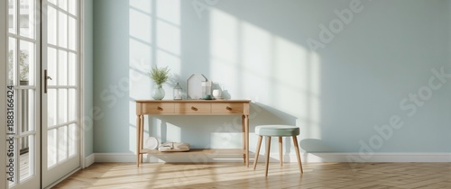 A mint-colored stool located near a blue wall within a room featuring a wooden console and large white glass doors behind