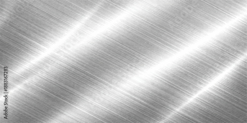 Brushed metal background with a polished steel plate texture featuring a shiny silver aluminum surface and industrial grey metallic reflection pattern on a stainless chrome sheet material
