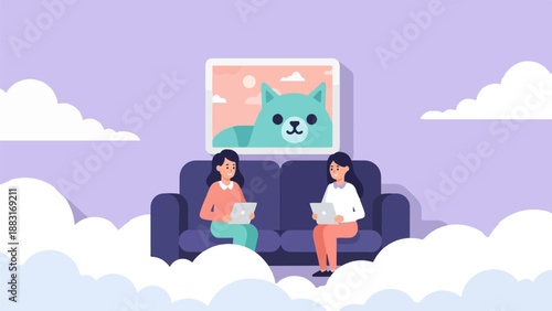 Two people on a couch, each with a laptop, under a cat painting
