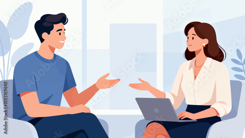 A man and a woman are sitting in a room, talking to each other. The man is wearing a blue shirt and the woman is wearing a white shirt. There is a laptop on the table in front of them