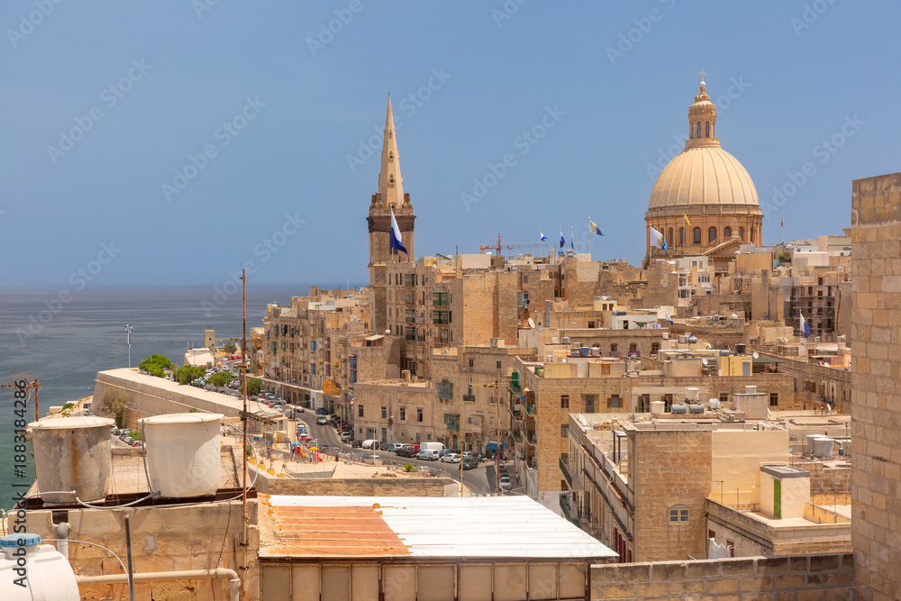 Fototapeta premium Panoramic view of rooftops and churches in Valletta, Malta