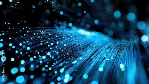 An abstract image featuring dynamic blue lines and glowing dots, creating a sense of movement and depth.