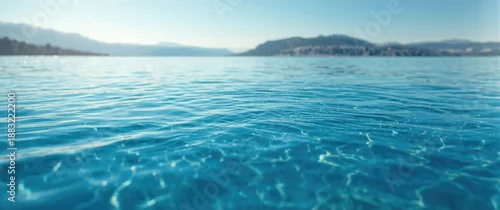 Panel kuchenny z motywem Beautiful textured calm blue water surface featuring ripples and a relaxing sunny day scene