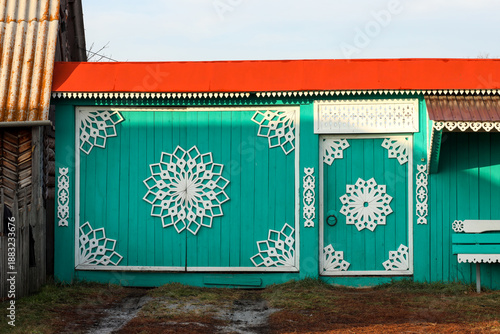 Wallpaper Mural an ornate wooden gate with carvings in an old village Torontodigital.ca