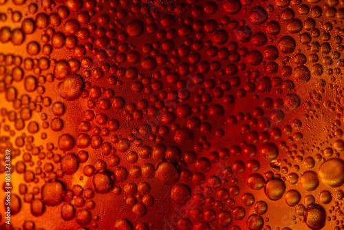 Bild auf Leinwand A close-up image of refreshing amber-colored cola soda bubbles against a golden light,Macro,An abstract macro shot of carbonated bubbles clinging to the side of a glass filled with a cold, Cola