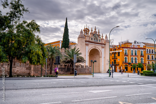 Popular place in Seville, Arco de la Macarena with walking people, Spain. Daily life on Spanish streets city.