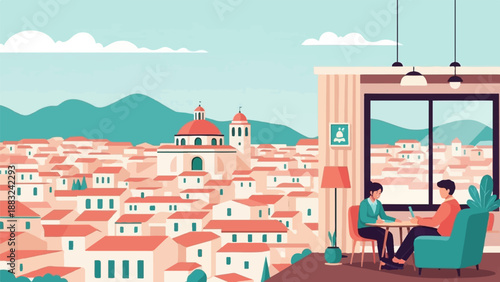 Two people chat at a table with a view of a town and mountains