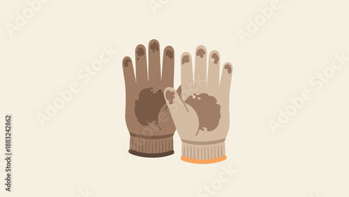 Two dirty gardening gloves displayed on a plain background
