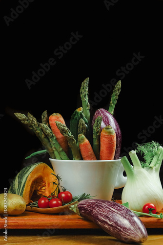 mixed vegetables on a table with black background