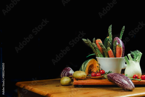 mixed vegetables on a table with black background
