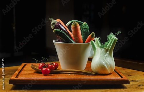 mixed vegetables on a table with black background