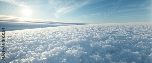 Snow surface in sunlight ba...