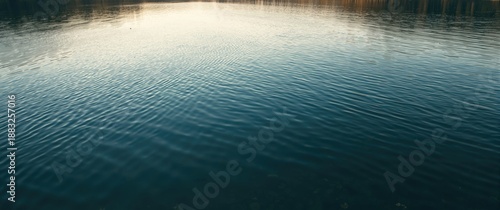 Tranquil lake with soft rip...