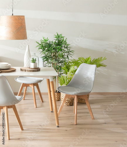 Nordic Dining Room, Featuring a White Dining Table Set with Gray Plastic Side Chairs with Wooden Legs, Adorned with Decorative Vases and White Ceramic Tableware on Placemats, Wooden Flooring.