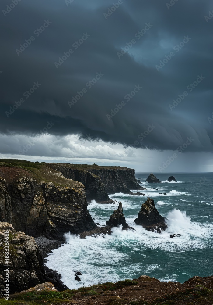 Obraz premium A dramatic dark storm cloud brewing over a rugged, wild coastline where huge waves violently crash against sharp, unforgiving cliffs ,dangerous ,ocean ,wild