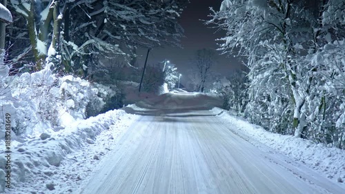 Snowy winter road at night