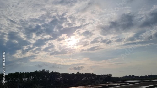 Wallpaper Mural Sun Peeking Through Dramatic Clouds Over Rural Salt Ponds Landscape Torontodigital.ca