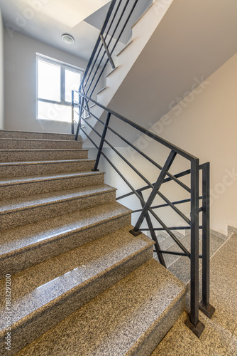 Wallpaper Mural Modern stair case between floors. Stairs with metallic rail in modern building. Interior of a contemporary apartment or office building. Architecture and real estate background. Torontodigital.ca