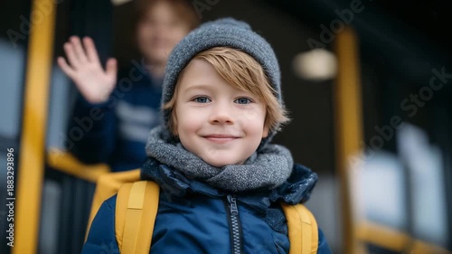 181Mid-shot of a child waving goodbye to a parent near the school gate, backpack secured tightly, winter coats and scarves, emotional moment of independence and growth