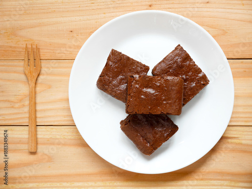 Homemade chocolate brownies on a white plate