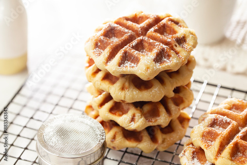 A Stack of Freshly Made Belgian Waffles on Cooling Rack