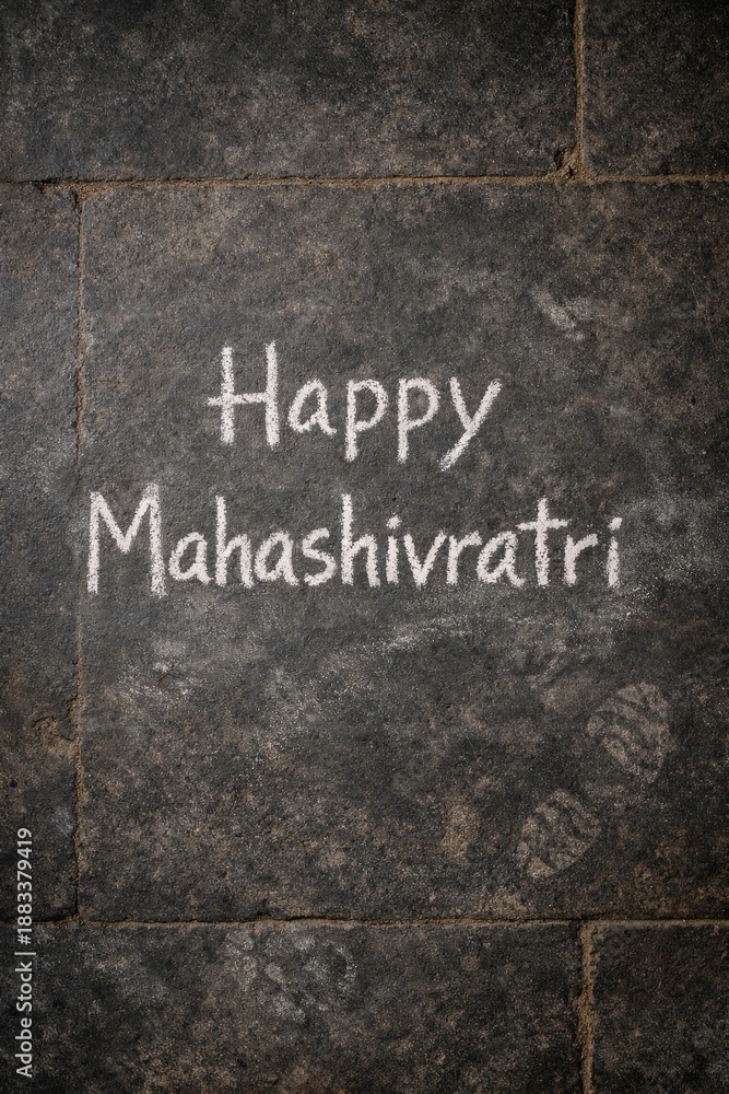 Fototapeta premium Happy Mahashivratri written in white chalk on stone
