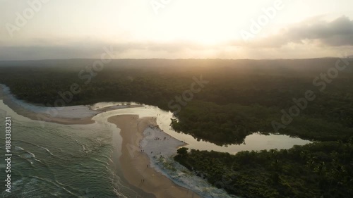 Wallpaper Mural Panoramic aerial image at sunset of Sargi beach and the Sargi River flowing into the beach, Serra Grande, a district of Uruçuca, southern coast of Bahia, beach with coconut trees, wide stretch of sand Torontodigital.ca