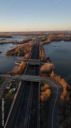 Golden hour reflections over Aquaduct Veluwemeer in the Netherlands