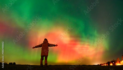 A person looking at Northern lights aurora borealis Lund Skane Sweden 19.01.2026