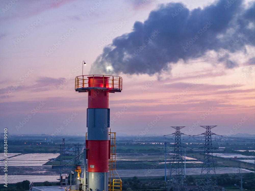 Naklejka premium aerial view power station during sunset