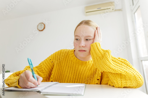 Εκτύπωση καμβά Teenage girl feeling tired while doing homework at home, student struggling with