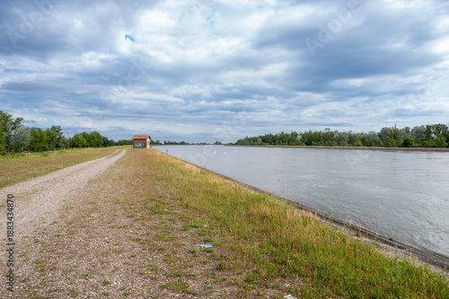 River embankment gravel path leading to water