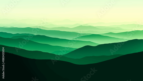 Mountain landscape with clouds and fog at sunrise view over the valley hills and blue sky during morning dawn mist