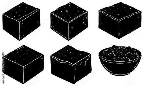 Six Black Cake Slices and a Bowl of Cake Pieces on White Background